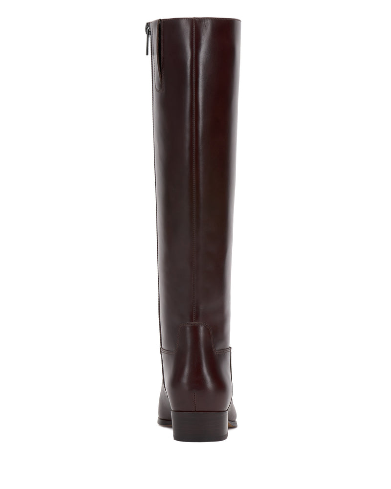 Shown from the back, the Vince Camuto Pavla Narrow Calf Knee High Boot displays classic western style in dark brown with a low heel and upper side zipper.