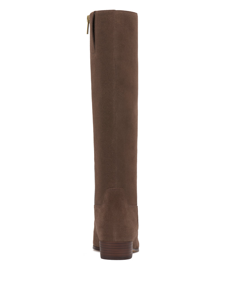 The Vince Camuto Pavla Knee High Boot is a tall brown suede boot with a low block heel and a back zipper, shown from the rear.