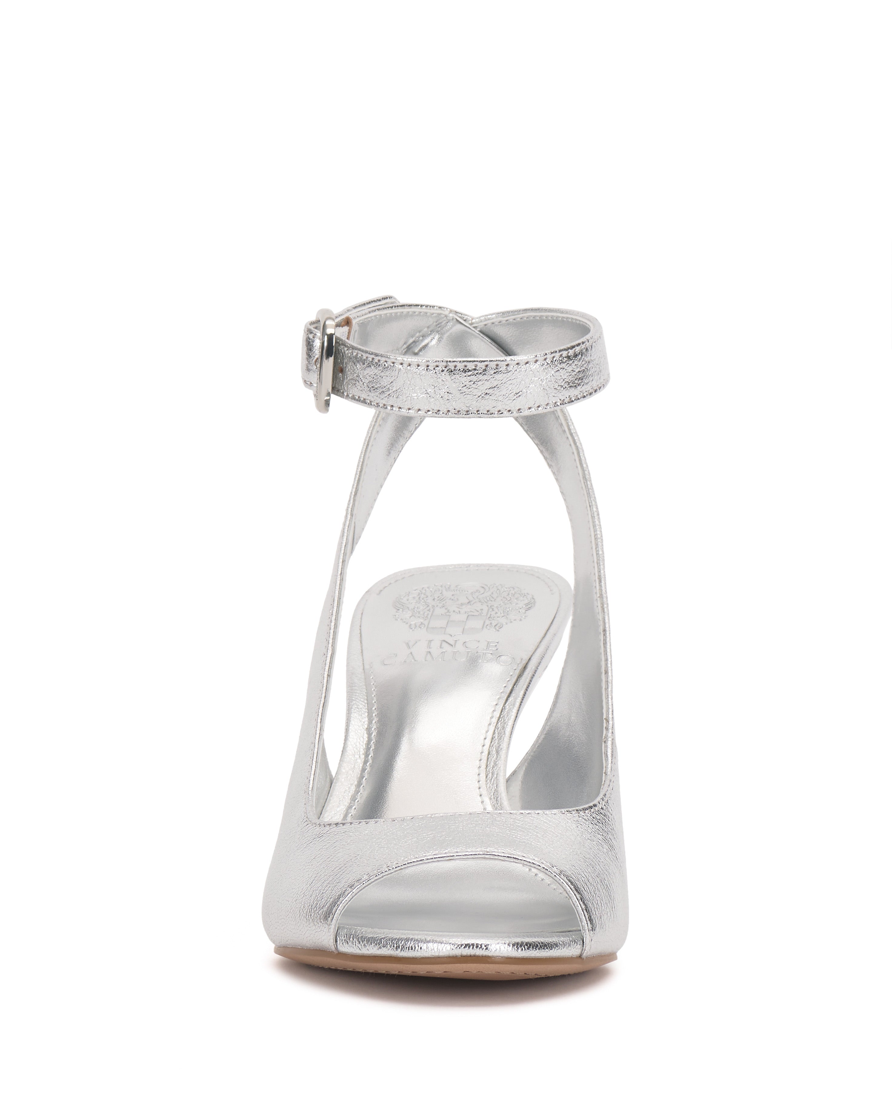 Front view of the Pavles Sandal by Vince Camuto: a shiny silver peep toe with a wrapped ankle strap, buckle, and elegant cutout side design on a smooth sole.