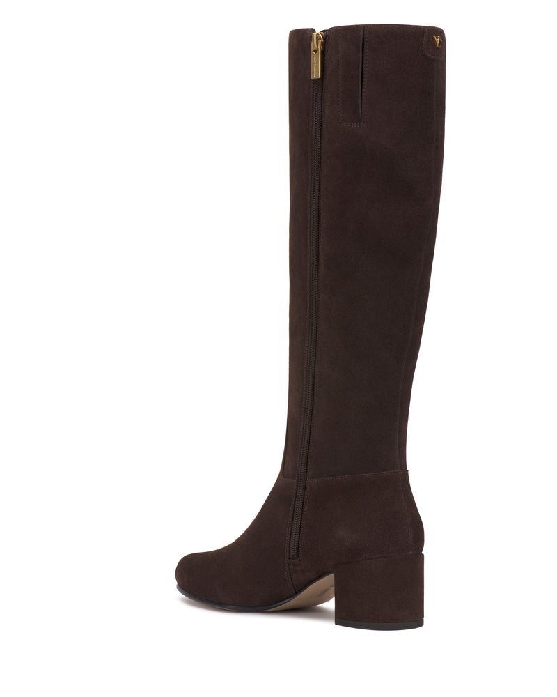 The Vince Camuto Pazzla Knee High Boot is a dark brown suede boot featuring a side zipper and a chunky mid-height heel, displayed at a slight angle against a white background.