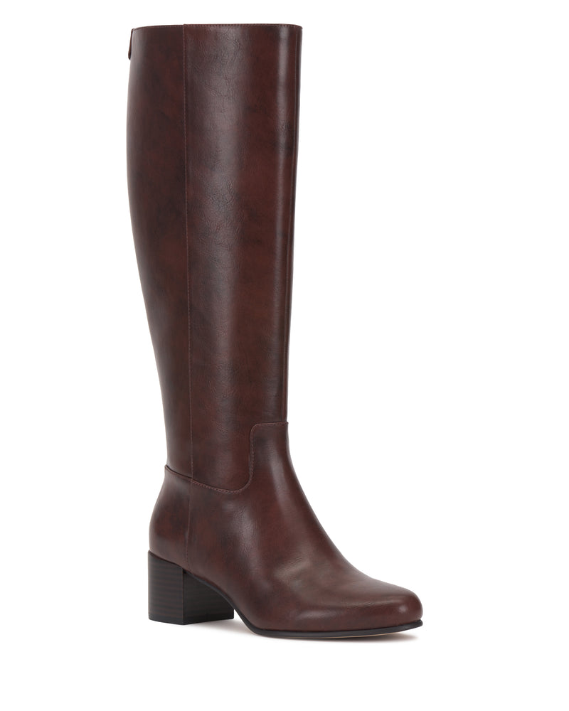 The Vince Camuto Pazzla Knee High Boot is shown in side profile against a white background, featuring a single tall, dark brown leather design with a low block heel, almond toe, and smooth finish.