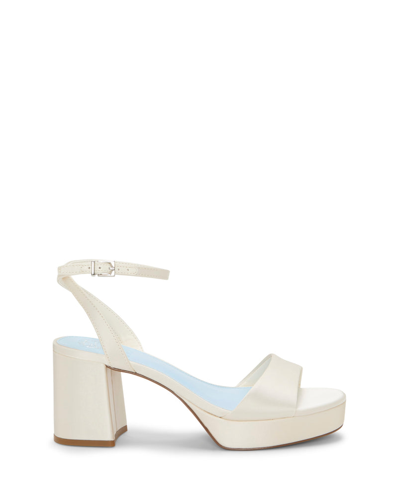 The Pendreya Platform Sandal by Vince Camuto features a cream-colored, open-toe block heel design with a light blue insole, ankle strap, and buckle closure. Shown against a white background, these retro-inspired sandals blend classic charm with modern comfort.