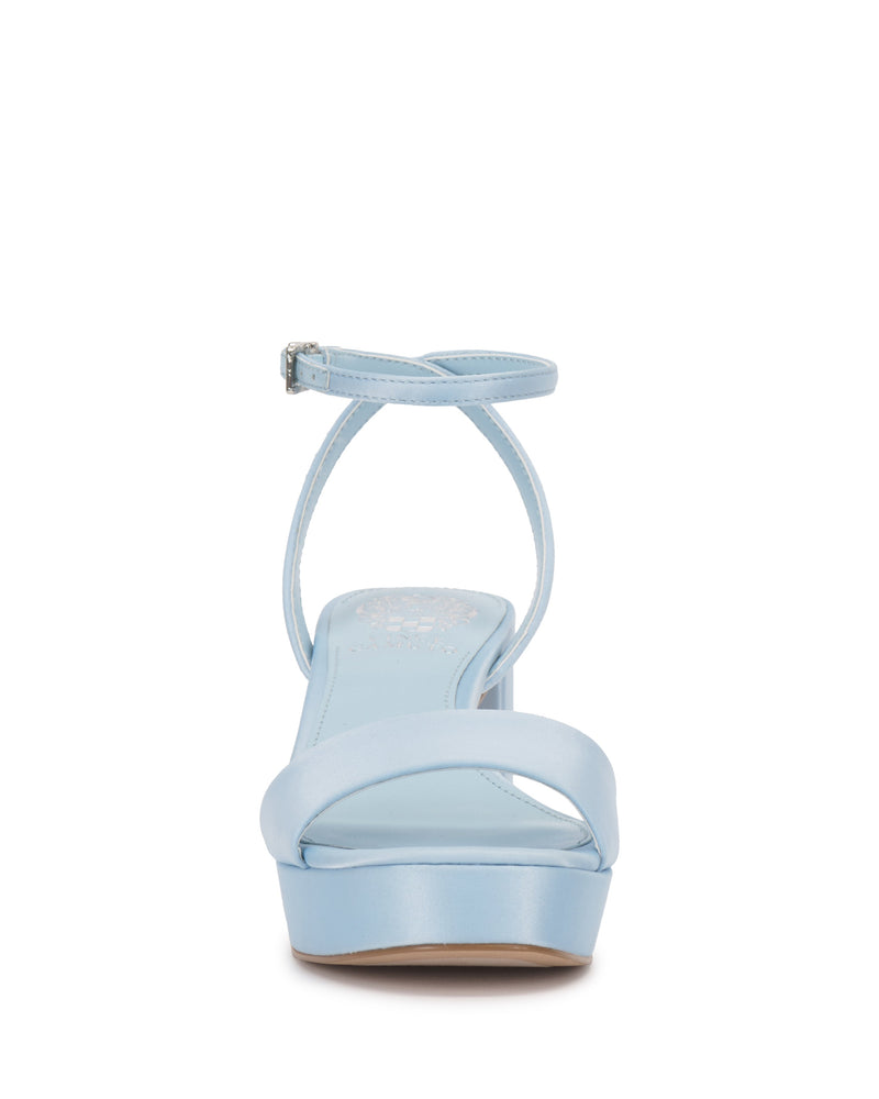 Front view of the Vince Camuto Pendreya Platform Sandal in light blue, featuring an open toe, single toe strap, ankle buckle strap, and a low platform sole for a chic retro look.