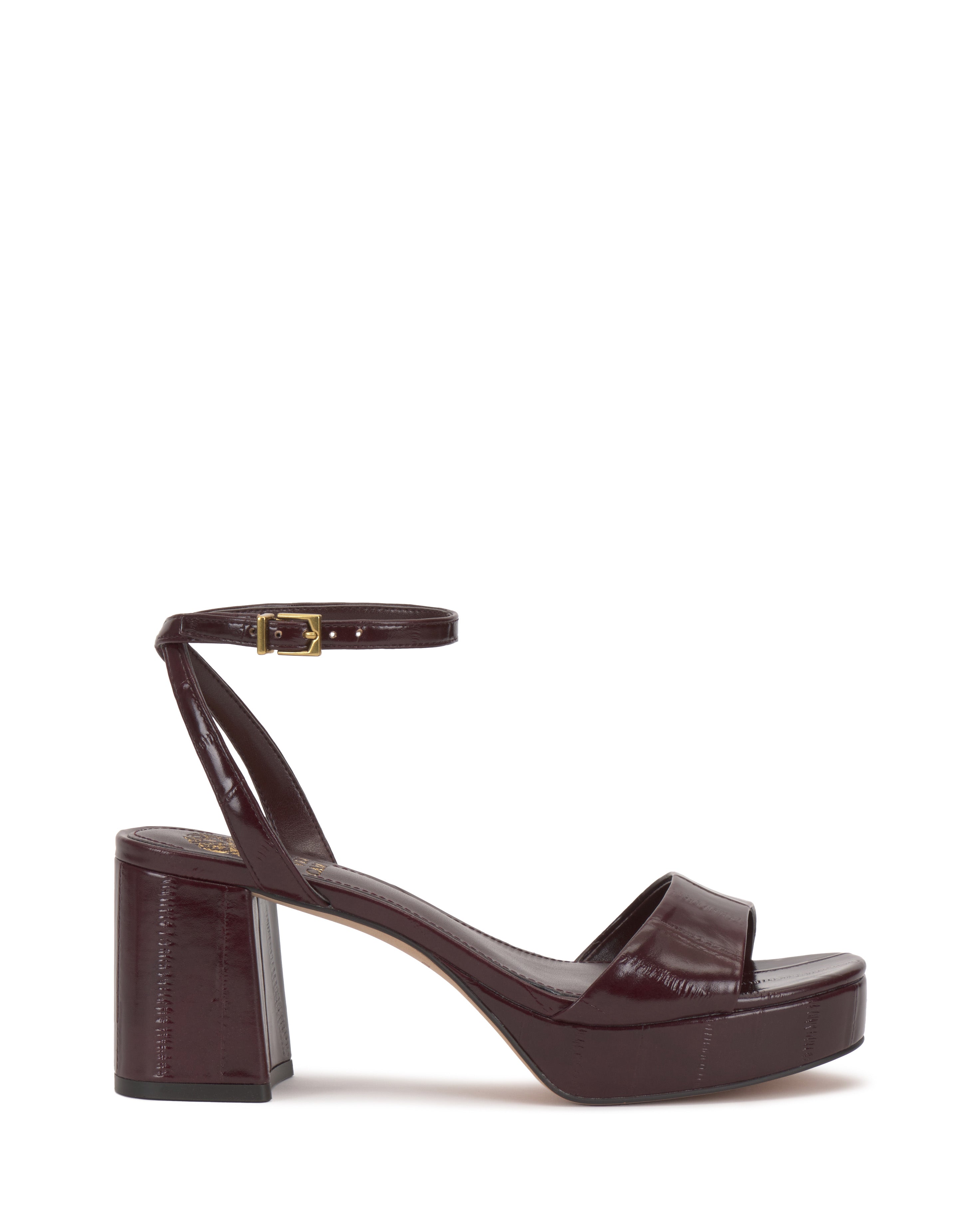 The Vince Camuto Pendreya Platform Sandal is a dark burgundy high-heeled shoe with a chunky block heel, single toe strap, ankle strap, and gold buckle, shown on a white background.