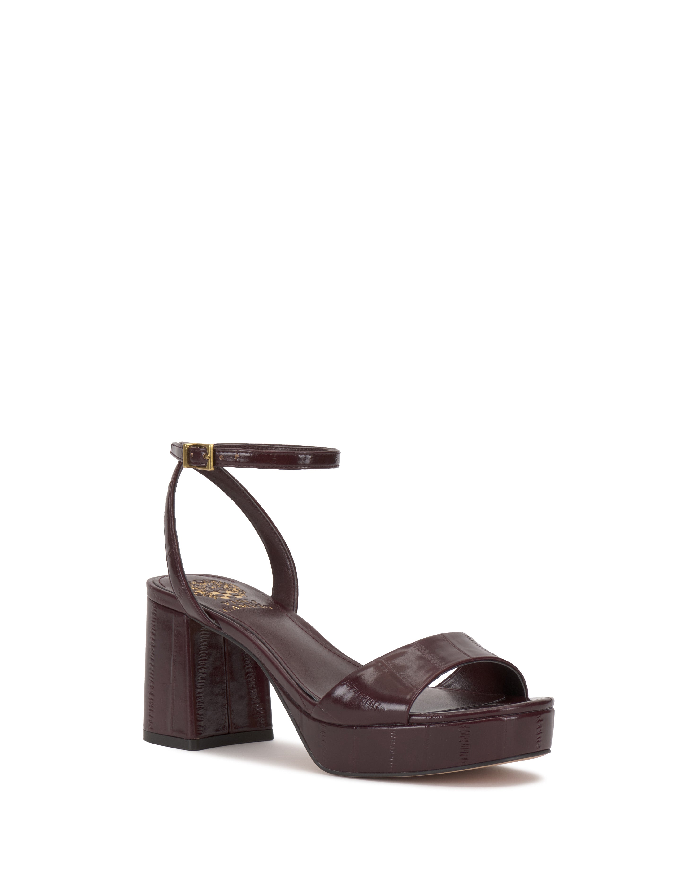 The Pendreya Platform Sandal by Vince Camuto features a burgundy finish, block heel, open toe, and slim buckled ankle strap—ideal for fans of retro sandal style, showcased against a plain white background.