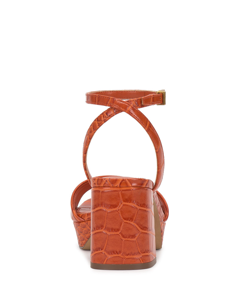 Back view of Vince Camuto's Pendreya Platform Sandal in orange, featuring faux reptile skin texture, block heel, and crisscross ankle straps with a buckle closure.