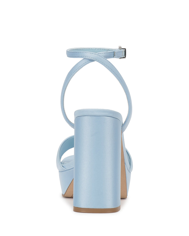 Rear view of the Vince Camuto Pendry Platform Sandal in light blue, showcasing a retro chunky block heel, ankle and crisscross straps, smooth finish, and buckle closure.