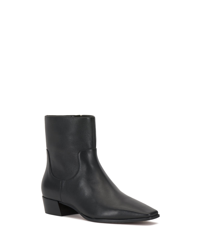 The Vince Camuto Pertula Bootie is a black leather pointed-toe ankle boot featuring a low block heel and side zipper. Displayed on a white background, this boot showcases a smooth finish and a simple, modern design.