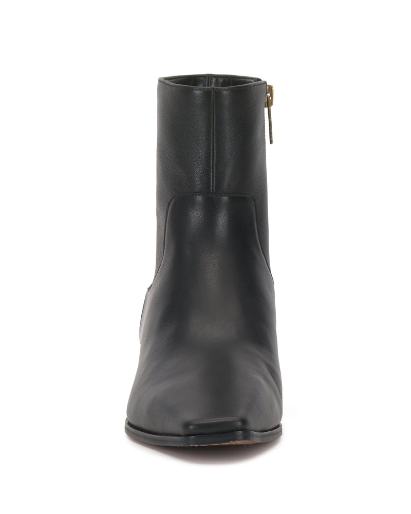 Front view of the Pertula Bootie by Vince Camuto in black leather, featuring a rounded toe and a visible side zipper on a white background, highlighting the refined craftsmanship characteristic of Vince Camuto footwear.