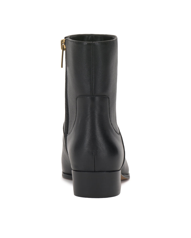 Back view of the Pertula Bootie by Vince Camuto in black leather, this pointed toe ankle boot features a low block heel and a visible side zipper with a gold pull tab, shown against a white background.