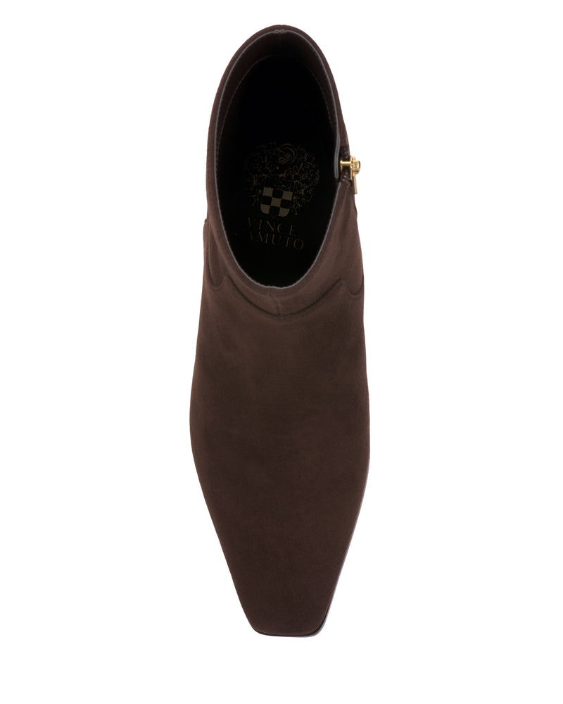 A top view of the Pertula Bootie by Vince Camuto, featuring brown suede material, a square toe, and a gold buckle detail, displayed on a white background.