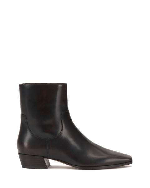 A side view of the Vince Camuto Pertula Bootie in dark brown leather, featuring a pointed toe and a low, angled block heel, displayed on a white background.