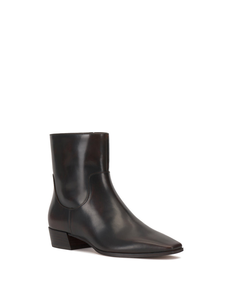 The Pertula Bootie by Vince Camuto is shown against a plain white background, featuring a single black leather design with a pointed toe, low block heel, and smooth finish.