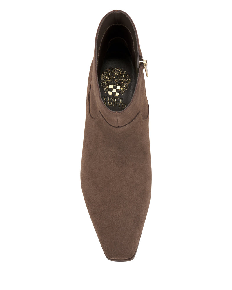 Top view of the Pertula Bootie by Vince Camuto—a brown suede pointed toe ankle bootie with a block heel and side zipper, featuring a gold floral pattern and the Vince Camuto logo on the insole.