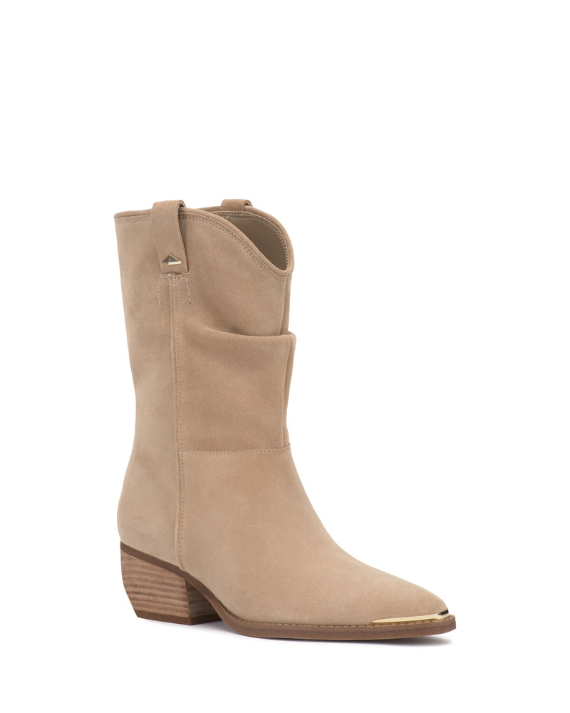 The Pezzra Western Bootie by Vince Camuto features tan suede, a mid-calf slouchy shaft, pointed toe with gold accents, and a wooden block heel. Shown against a white background.