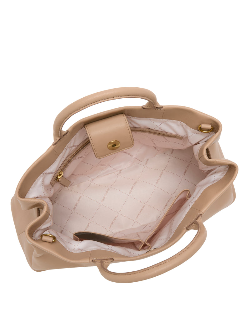 Top view of the Vince Camuto Rilah Satchel Bag, open to reveal a quilted light pink interior with a zippered pocket, snap button pocket, and gold hardware on the handles.