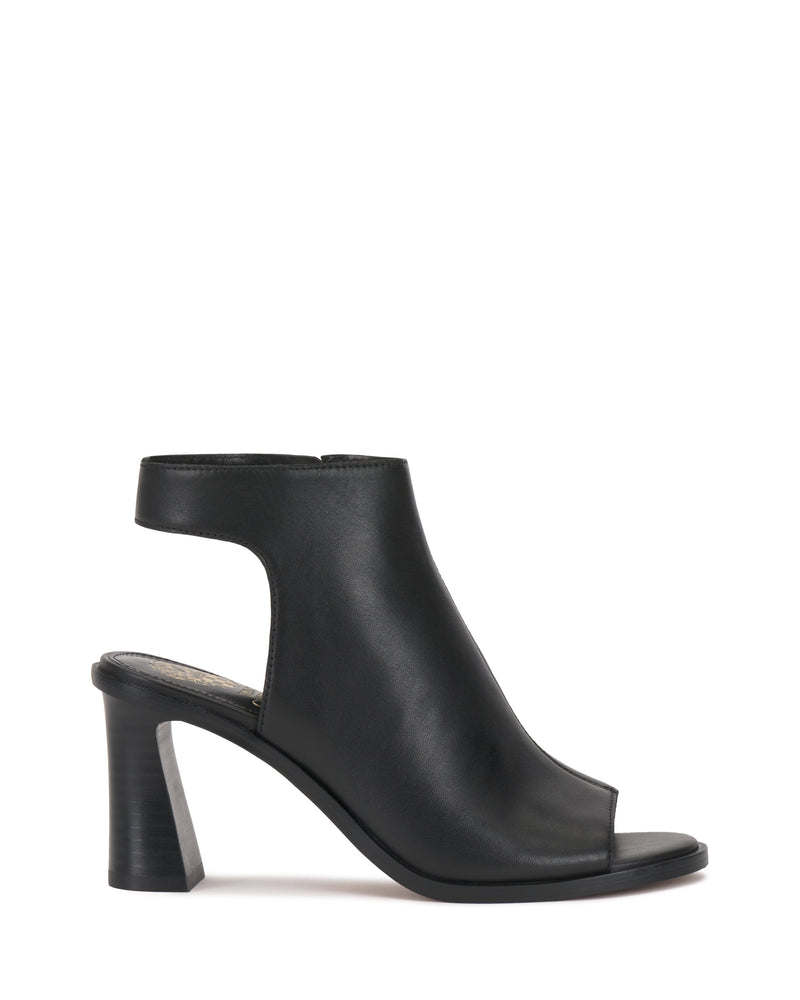 The Rimdia Sandal by Vince Camuto is a black peep-toe, high-heeled slingback with ankle cut-outs, a chunky block heel, and a back strap, displayed in profile against a white background.