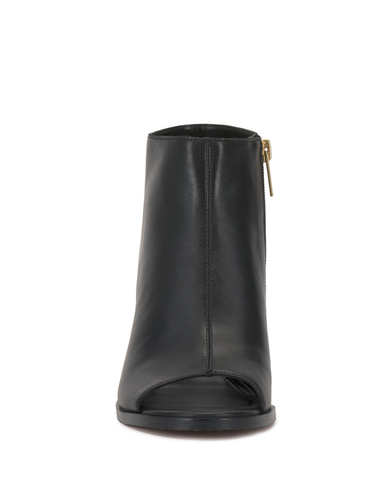 Front view of the Vince Camuto Rimdia Sandal—a black leather peep-toe bootie with a side zipper and gold pull, featuring a chic block heel—shown against a white background.