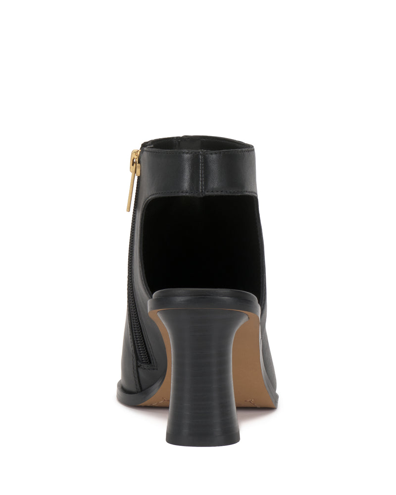 Rear view of the Vince Camuto Rimdia Sandal in black, featuring a side zipper and flared stacked block heel, set against a white background.