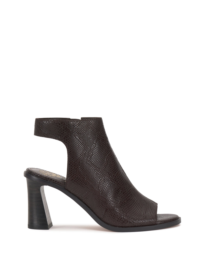 The Vince Camuto Rimdia Sandal features a dark brown peep toe, textured leather finish, cutout sides, thick block heel, and open back for a chic slingback look with modern style.