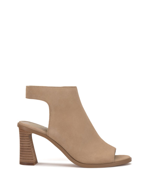 The Vince Camuto Rimdia Sandal is a tan suede slingback with an open toe, cutout heel strap, and stacked block heel, shown in a side view against a white background.