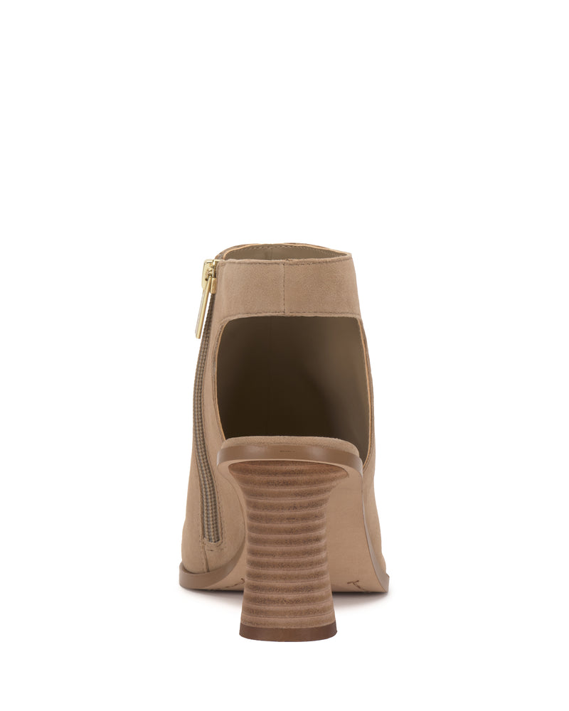Back view of the Vince Camuto Rimdia Sandal in beige, showcasing a stacked wooden block heel, heel counter zipper closure, and ankle cutout design.
