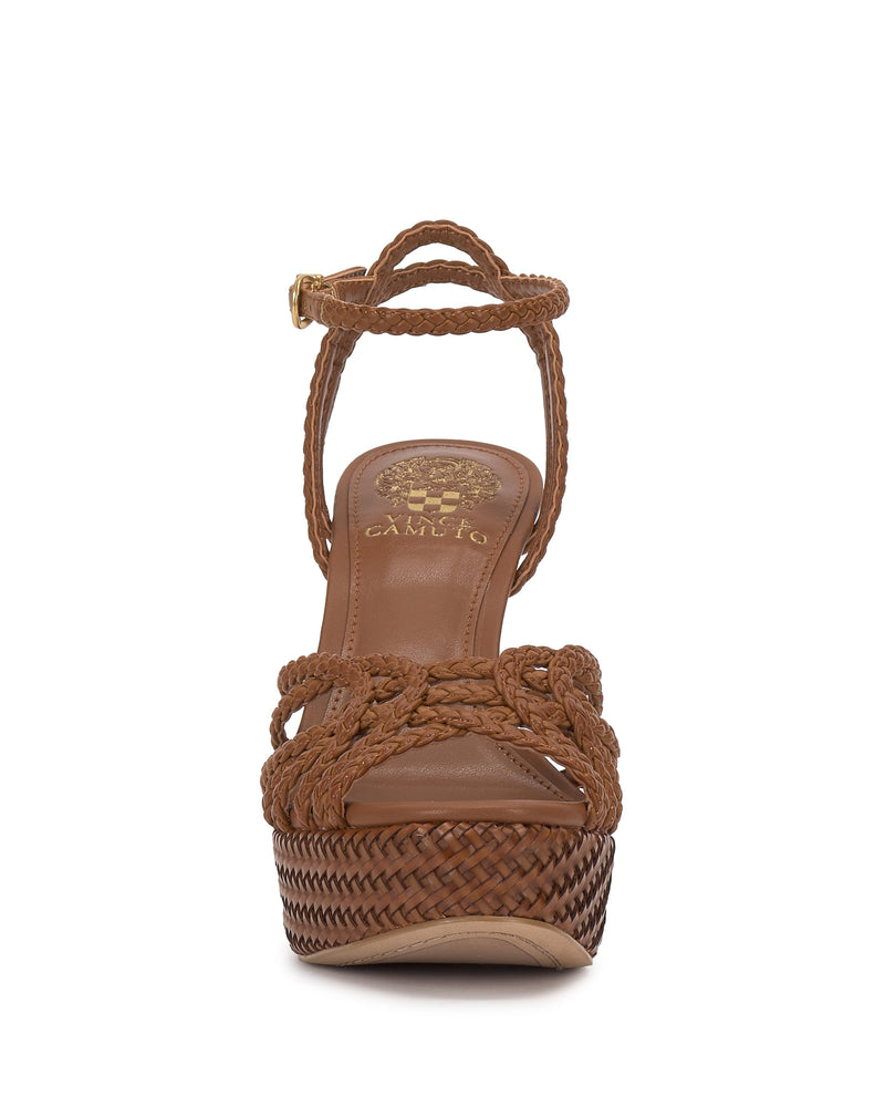 Front view of the Vince Camuto Samlee Strappy Platform Sandal in brown, featuring braided straps, adjustable ankle strap with buckle, high chunky block heel, and a gold Vince Camuto logo on the insole.
