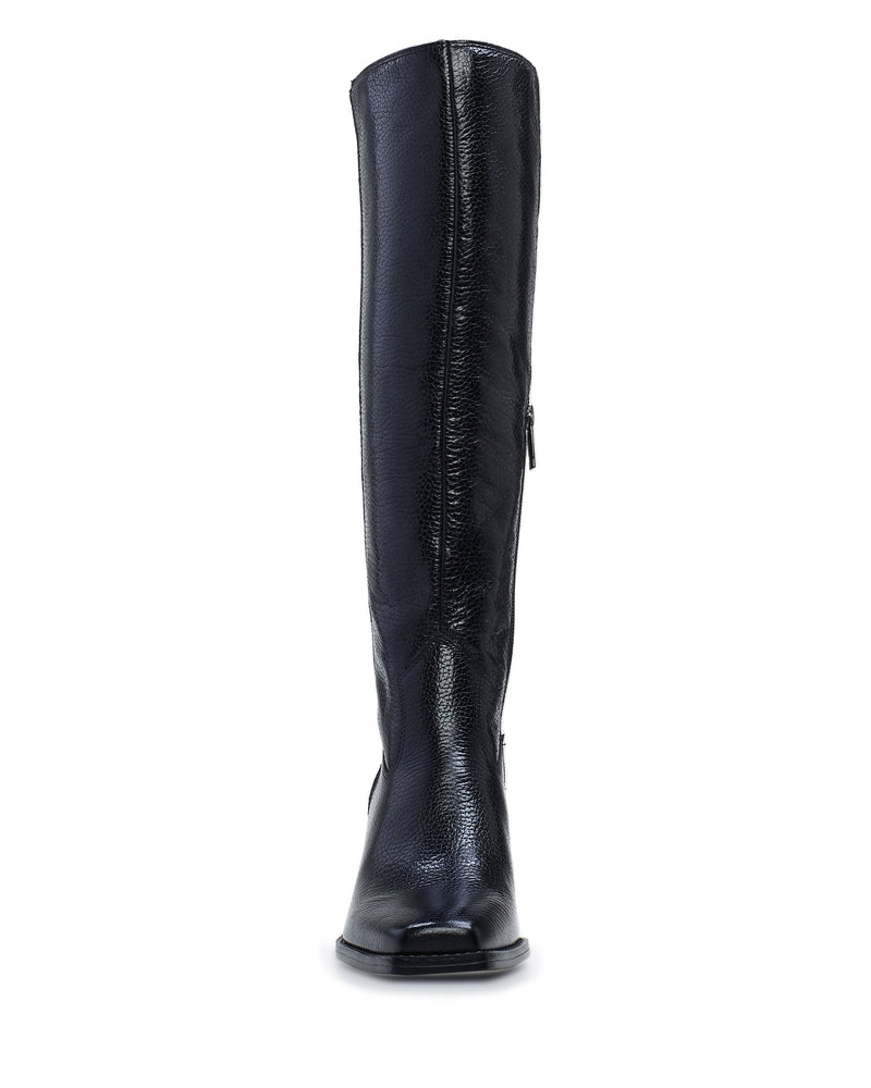 The Vince Camuto Sangeti Boot is pictured upright from the front, featuring a sleek black leather finish, modern square toe, and a visible side zipper.