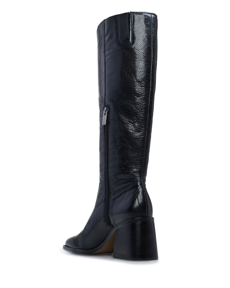 The Vince Camuto Sangeti Boot is a best-selling tall boot in black textured leather, featuring a square toe, side zipper, and chunky mid-height heel, shown from a rear side angle on a white background.