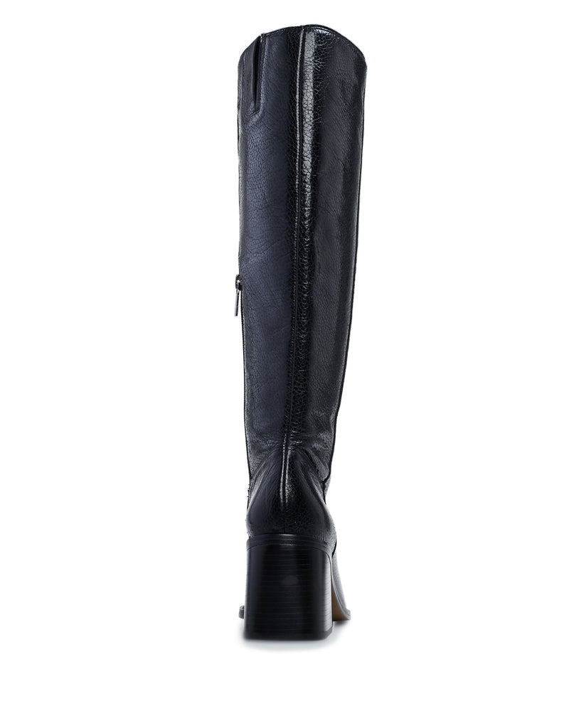 The Vince Camuto Sangeti Boot is shown from the back, highlighting its black leather knee-high design with a block heel, side zipper, and subtle stitching.