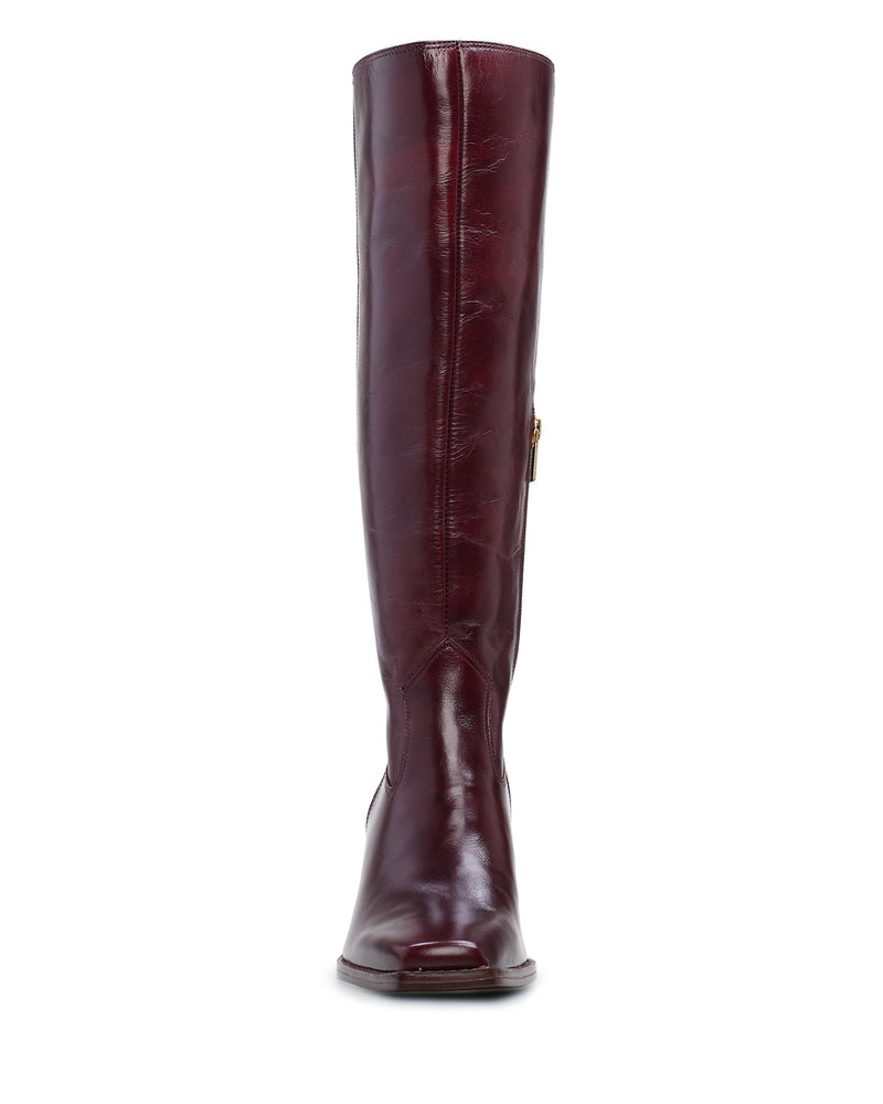 Front view of the Sangeti Boot by Vince Camuto—a tall, shiny burgundy leather boot featuring a slight block heel, square toe, and visible side zipper.