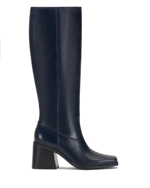 The Sangeti Boot by Vince Camuto is shown in profile on a white background. This tall, navy blue leather knee-high boot features a square toe and a chunky, medium-height block heel, and is available in multiple calf widths.