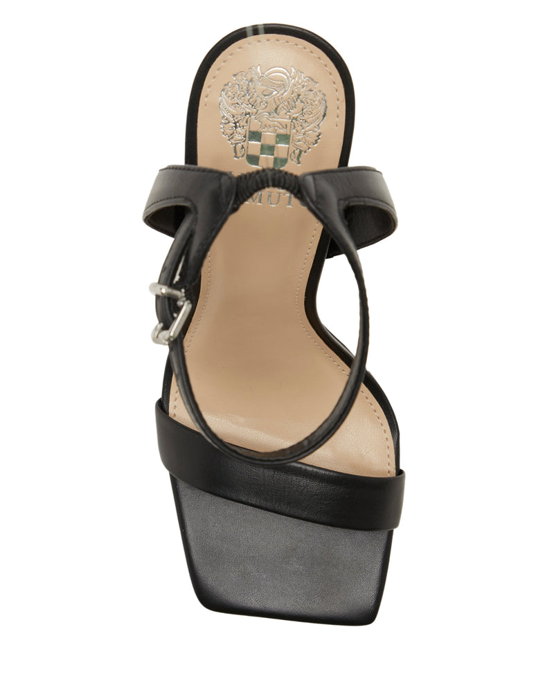 The Vince Camuto Saprenda Sandal features a wide front strap, thin buckle ankle strap, and square toe. Its beige insole has an embossed logo and emblem. Available in classic or metallic leathers for a chic look.