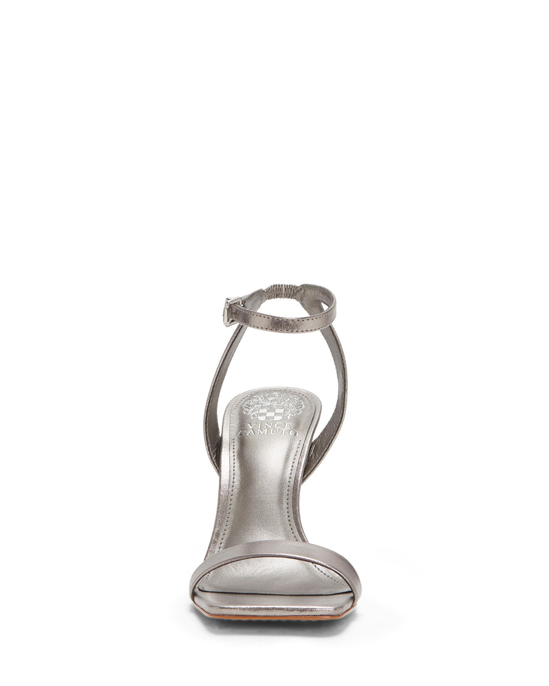 Front view of the Saprenda Sandal by Vince Camuto, a single silver dress sandal crafted from metallic leather, featuring an open toe, ankle strap, and thin heel against a white background.