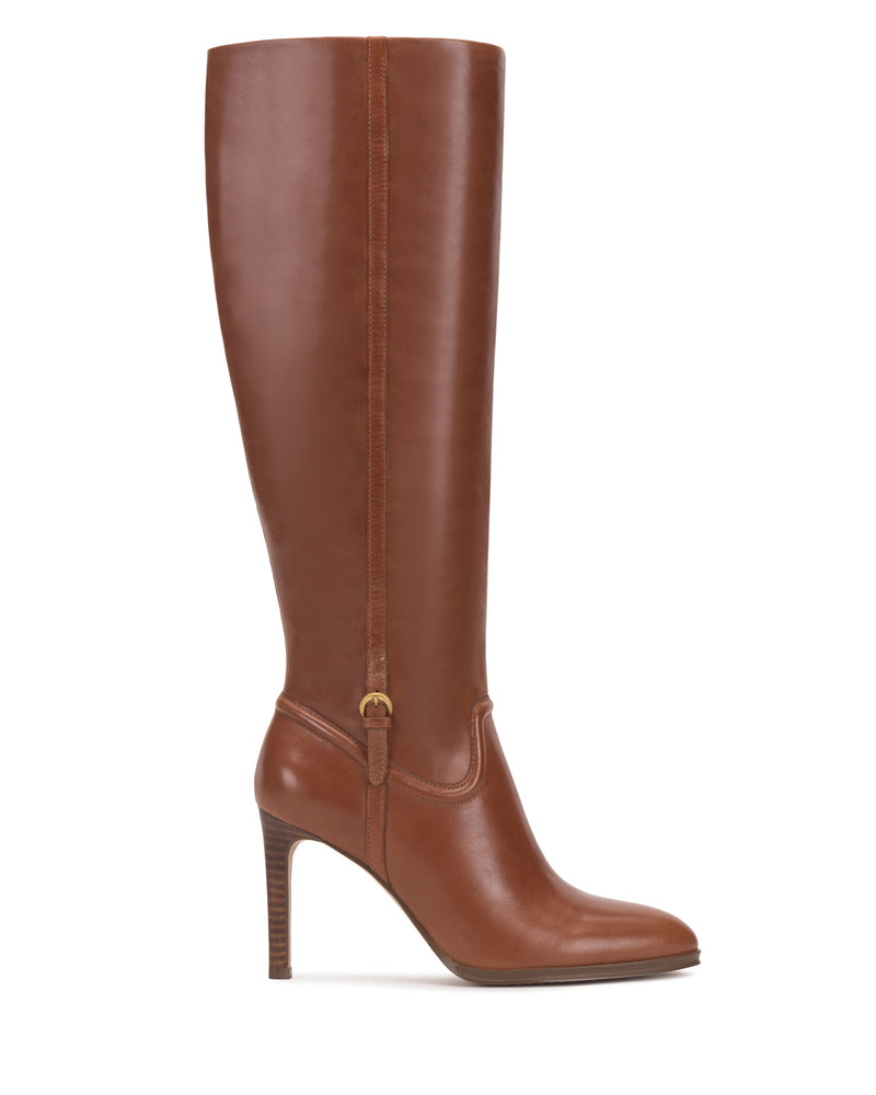 A single Vince Camuto Sareya Wide Calf Knee High Boot in brown leather, featuring a high heel and rounded toe, is shown in profile on a white background.
