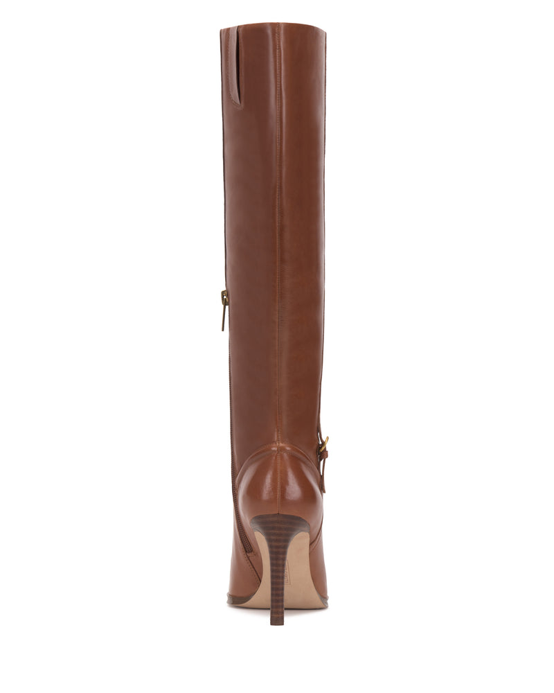 The Sareya Wide Calf Knee High Boot by Vince Camuto is a tall brown leather boot viewed from the back, showcasing a pointed toe, side zipper, and slim stiletto heel.