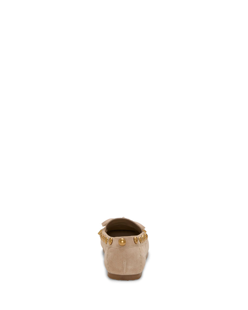 The Vince Camuto Sennett Studded Mocassin in beige suede is shown from the back, featuring gold stud accents on the heel and a refined bow detail on top.