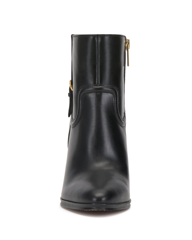 Front view of the Vince Camuto Setily Bootie, a black leather ankle boot featuring a gold side zipper, displayed against a white background.