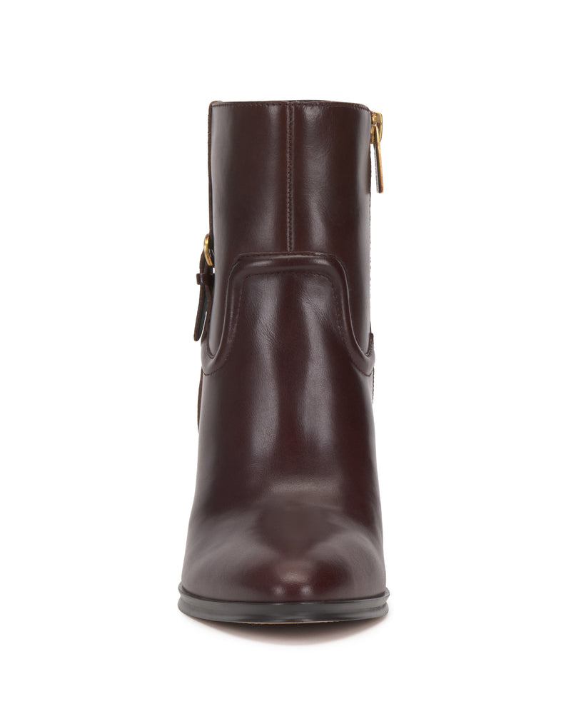 Front view of the Vince Camuto Setily Bootie in dark brown leather, featuring a side zipper and buckle detail, displayed on a white background.