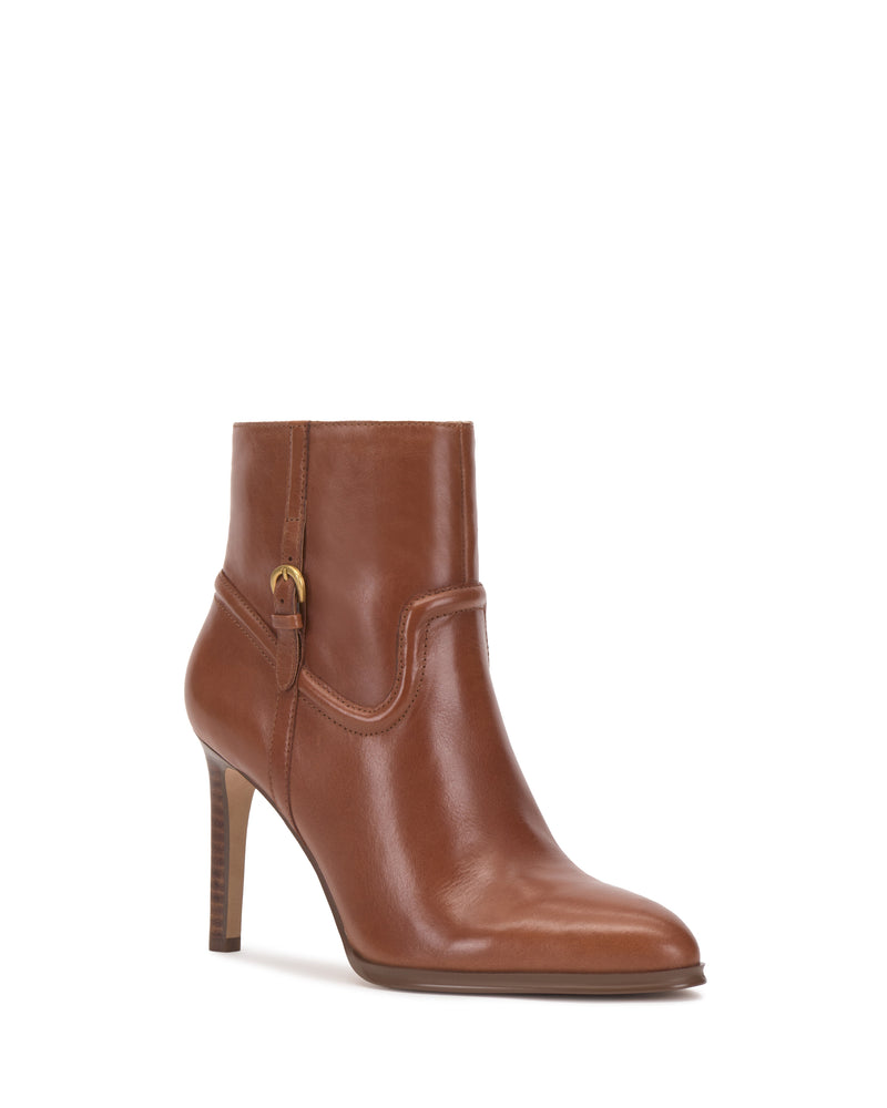 The Setily Bootie by Vince Camuto is a single brown leather ankle boot featuring a pointed toe, high heel, and a small buckle detail on the side, displayed against a plain white background.