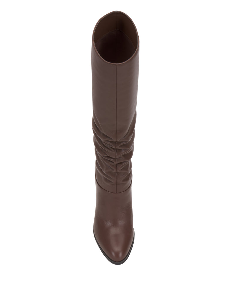 Top view of the Vince Camuto Sorina Wide Calf Knee High Boot in brown leather, featuring a slouched shaft and pointed toe, photographed on a white background.