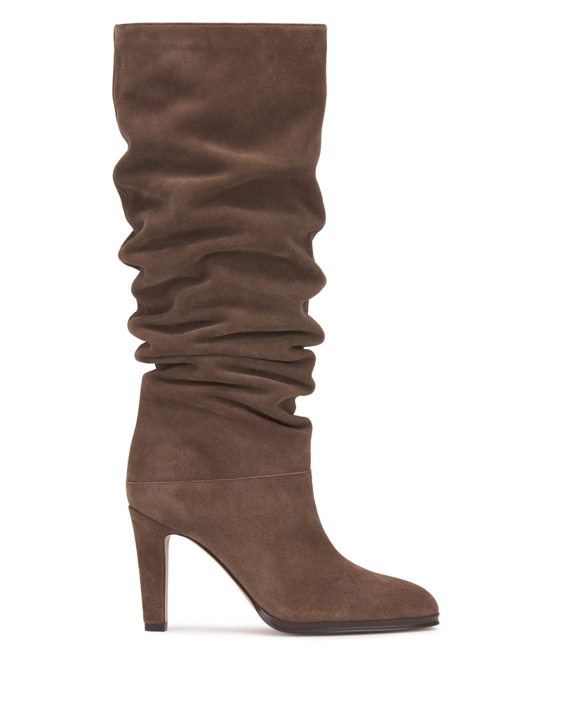 The Sorina Wide Calf Knee High Boot by Vince Camuto, featuring a tall silhouette with a slouchy brown suede shaft and high heel, is shown in a side view on a plain white background.