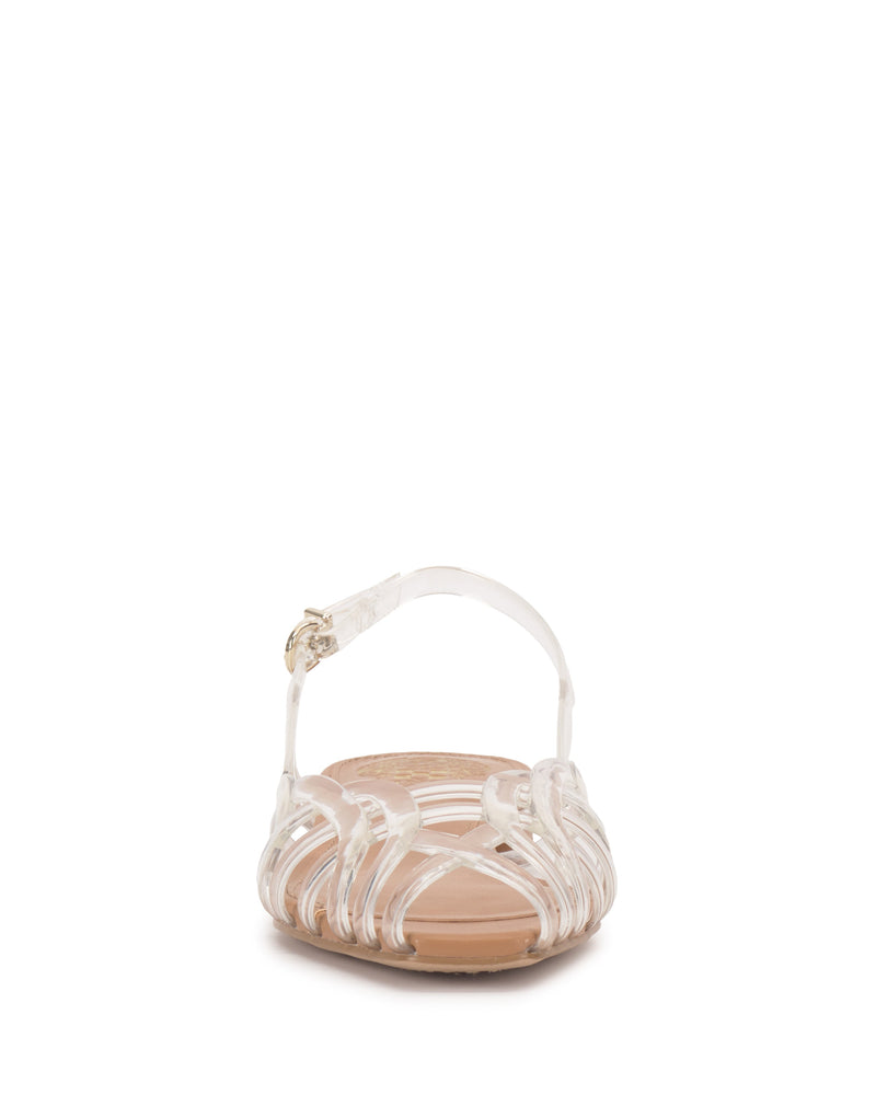 Front view of the Vince Camuto Stiorra Sandal, a clear jelly flat with closed toe, translucent braided straps, and an ankle strap with gold buckle, set against a white background.