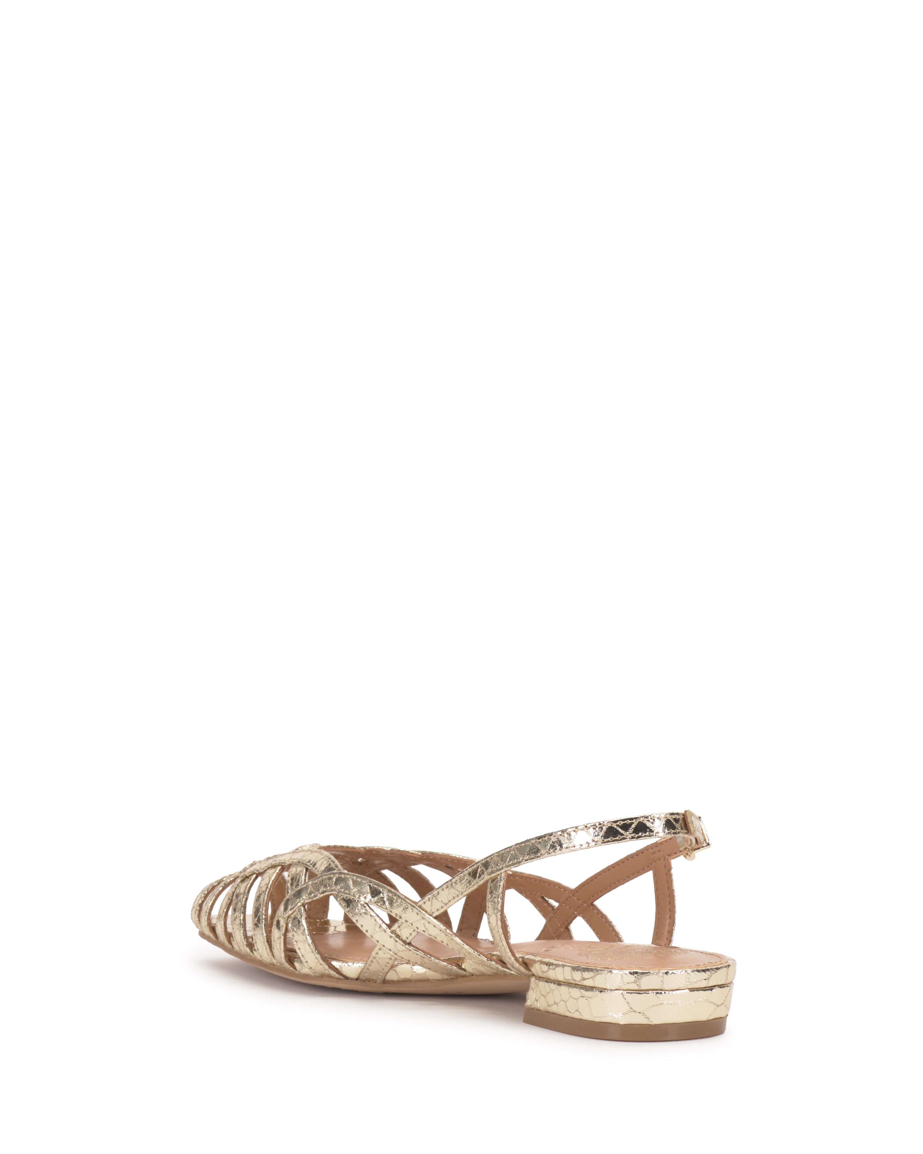 The Vince Camuto Stiorra Sandal features gold metallic crisscross straps, braided detailing, and a low block heel, shown from the back at a slight angle on a white background.