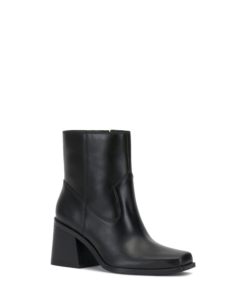 The Sybren Bootie by Vince Camuto features sleek black leather, a chunky block heel, and a square toe, showcased against a white background for a touch of modern sophistication.