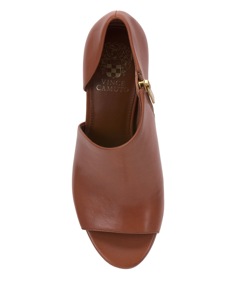 A top view of the Vince Camuto Telemi D’Orsay Sandal in brown leather, featuring a side buckle, is displayed against a white background, highlighting its sculptural elegance—an ideal choice for evening dressing.