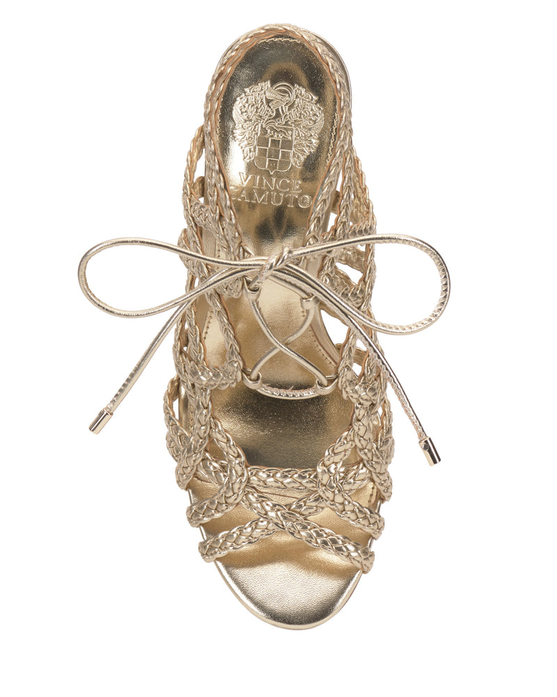 Top view of the Tilly Sandal by Vince Camuto: a gold, open-toe stiletto with braided straps, a front bow, and the Vince Camuto logo on the insole.