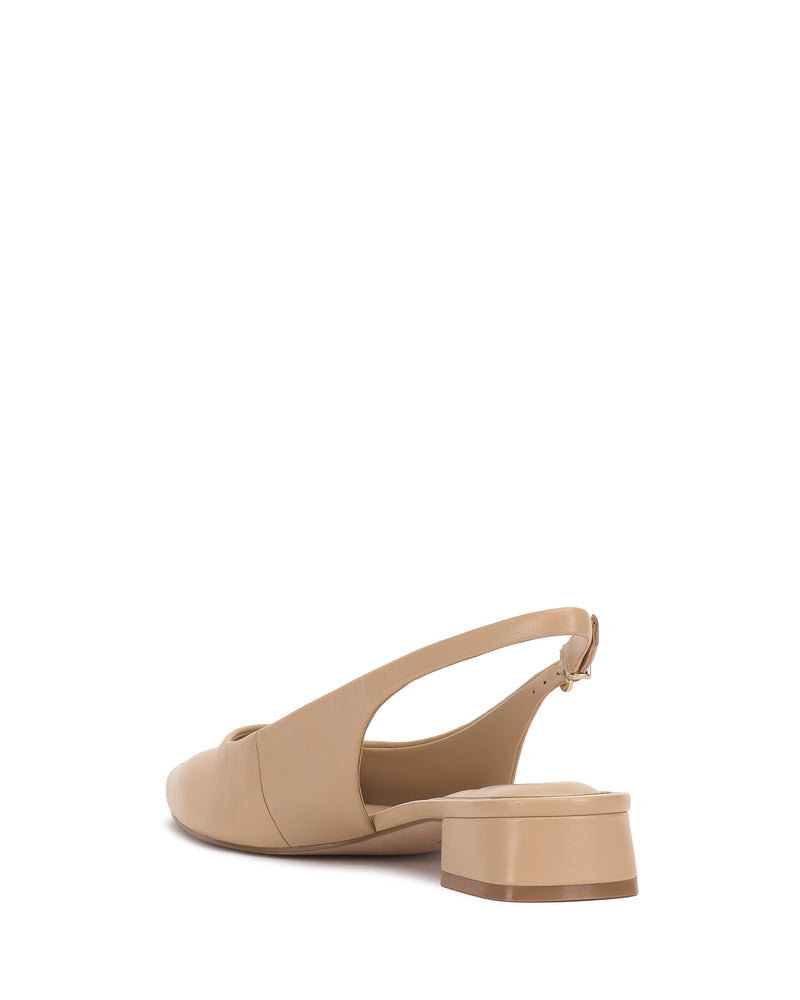 The Vince Camuto Valiey Slingback Pump is a beige, pointed-toe mule with a low block heel and closed toe, shown from the back and slightly to the side against a white background.