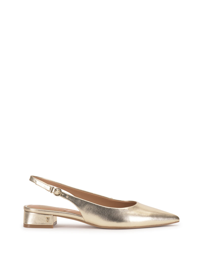 The Vince Camuto Valiey Slingback Pump is a gold metallic mule featuring a pointed toe, low block heel, and adjustable buckle strap, shown on a white background.