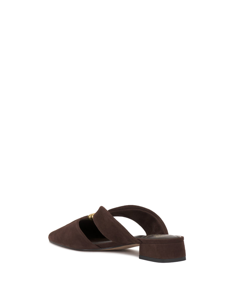 A single brown suede Vince Camuto Vanika Mule with a pointed toe and low block heel is shown from the side and back, highlighting a decorative gold accent on the upper strap.